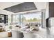 Relaxing resident lounge showcasing plush seating, stylish décor, and expansive windows offering views at 4200 W 17Th Ave # 211, Denver, CO 80204