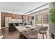 Modern dining room boasts a large table, balcony access, and a spacious layout at 4200 W 17Th Ave # 211, Denver, CO 80204