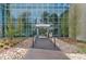 Elegant building entrance with modern glass doors and well-maintained landscaping at 4200 W 17Th Ave # 211, Denver, CO 80204