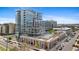 Modern high-rise building with a rooftop pool and outdoor lounge area, offering stunning city views at 4200 W 17Th Ave # 211, Denver, CO 80204