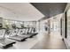 Well-equipped gym with modern treadmills, weights, and floor to ceiling windows at 4200 W 17Th Ave # 211, Denver, CO 80204