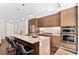 Modern kitchen with stainless steel appliances, granite counters, and a large island at 4200 W 17Th Ave # 211, Denver, CO 80204