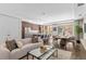 Bright open-concept living room and kitchen boasts hardwood floors and modern finishes at 4200 W 17Th Ave # 211, Denver, CO 80204
