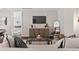 Comfortable living room with contemporary decor, and view of the bedroom through an open door at 4200 W 17Th Ave # 211, Denver, CO 80204