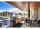 Outdoor kitchen area with stainless steel grills and dining seating at 4200 W 17Th Ave # 211, Denver, CO 80204