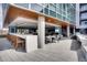Outdoor lounge area with bar seating, dining tables and lounge furniture at 4200 W 17Th Ave # 211, Denver, CO 80204