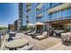 Upscale outdoor lounge with comfortable furniture and umbrellas for sunny days at 4200 W 17Th Ave # 211, Denver, CO 80204