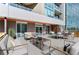 Enjoy outdoor living and dining on the spacious patio with comfortable seating and a dining area at 4200 W 17Th Ave # 211, Denver, CO 80204