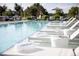 Inviting pool area with lounge chairs, perfect for relaxing and enjoying the summer sun at 4200 W 17Th Ave # 211, Denver, CO 80204