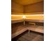 Relaxing cedar sauna with built-in benches and ambient lighting at 4200 W 17Th Ave # 211, Denver, CO 80204