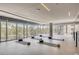 Bright yoga studio with mats, blocks, and floor-to-ceiling windows showcasing serene outdoor views at 4200 W 17Th Ave # 211, Denver, CO 80204