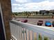 Scenic balcony view overlooking the community, showcasing the neighborhood's layout and nearby amenities at 1851 S Dunkirk St # 201, Aurora, CO 80017