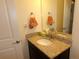 Well-maintained bathroom featuring a granite countertop, modern sink, and a vanity mirror at 1851 S Dunkirk St # 201, Aurora, CO 80017
