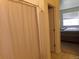 A doorway between the bedroom and bathroom featuring a tiled floor at 1851 S Dunkirk St # 201, Aurora, CO 80017