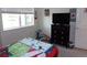 Well-lit bedroom with neutral colors and window view, creating a relaxing environment at 1851 S Dunkirk St # 201, Aurora, CO 80017