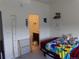 A bedroom with a glimpse into the bathroom at 1851 S Dunkirk St # 201, Aurora, CO 80017