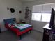 Cozy bedroom with natural light, offering a comfortable and inviting space at 1851 S Dunkirk St # 201, Aurora, CO 80017