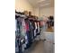 Walk-in closet featuring built-in shelving and ample storage for clothing and accessories at 1851 S Dunkirk St # 201, Aurora, CO 80017
