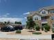 Charming apartment building with a mix of stone and siding, surrounded by well-kept landscaping and parking at 1851 S Dunkirk St # 201, Aurora, CO 80017