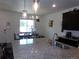 Granite kitchen island with a sink and pendant lighting provides ample workspace at 1851 S Dunkirk St # 201, Aurora, CO 80017