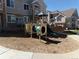 Community playground with slide and play structure set in mulch at 1851 S Dunkirk St # 201, Aurora, CO 80017