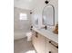 Bathroom featuring a shower over tub, light colored tile, and dark hardware at 3435 W 17Th Ave, Denver, CO 80204