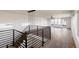 Bright living room with hardwood floors, iron railings, and modern pendant lighting at 3435 W 17Th Ave, Denver, CO 80204