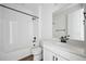 Bright bathroom with a shower-tub combo and white vanity at 25283 E Warren Pl, Aurora, CO 80018