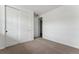 A cozy bedroom features a closet with double doors at 25283 E Warren Pl, Aurora, CO 80018