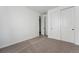 Clean, carpeted bedroom with a closet, fresh paint, and ample space for furniture at 25283 E Warren Pl, Aurora, CO 80018
