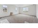 A spacious bedroom with natural light and plush carpeting at 25283 E Warren Pl, Aurora, CO 80018