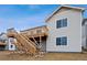 Newly constructed home with a spacious deck and a stairway at 25283 E Warren Pl, Aurora, CO 80018