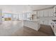 Modern kitchen with an island, new appliances, sleek cabinets, and lots of natural light at 25283 E Warren Pl, Aurora, CO 80018