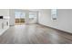 Bright, open living space featuring hardwood floors, natural light, and a private balcony at 25283 E Warren Pl, Aurora, CO 80018