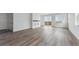 Spacious living area featuring hardwood floors, natural light, and an adjacent private balcony at 25283 E Warren Pl, Aurora, CO 80018