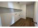 Utility room with wood floor and convenient hookups at 3909 N Shawnee St, Aurora, CO 80019