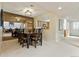 Cozy dining room featuring a dark table, view to the kitchen, and neutral decor at 2770 S Elmira St # 42, Denver, CO 80231