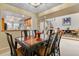 Elegant dining room featuring a sleek table with seating for six, conveniently adjacent to the kitchen at 2770 S Elmira St # 42, Denver, CO 80231