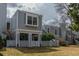 Charming two-story townhouse featuring grey siding, white trim, and a well-manicured front yard at 2770 S Elmira St # 42, Denver, CO 80231