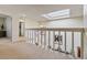 Well-lit hallway features a skylight and access to multiple rooms, ensuring a bright and open feel at 2770 S Elmira St # 42, Denver, CO 80231