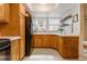 Bright kitchen offers abundant cabinet space and a window providing natural light and views of the outdoors at 2770 S Elmira St # 42, Denver, CO 80231