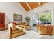 Bright and airy living room featuring a vaulted ceiling, modern decor, and access to the patio at 2770 S Elmira St # 42, Denver, CO 80231