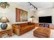 Cozy living room highlighted by a comfortable sofa, stylish decor, and media center, perfect for relaxation at 2770 S Elmira St # 42, Denver, CO 80231