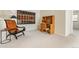 Bright living room featuring neutral carpet, a unique desk, and comfortable seating by a side table and decorative wall art at 2770 S Elmira St # 42, Denver, CO 80231