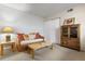 Bright living room showcases a wicker sofa with colorful cushions, a coffee table, and built in storage cabinet at 2770 S Elmira St # 42, Denver, CO 80231