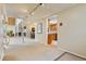 Open living space with a view of kitchen and multiple seating areas and plenty of natural light at 2770 S Elmira St # 42, Denver, CO 80231