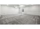 Large basement area with neutral walls and carpet at 9359 Russell Cir, Arvada, CO 80007