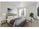 Relaxing bedroom featuring cozy textures, neutral colors, and a bright window at 9359 Russell Cir, Arvada, CO 80007