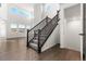 Grand entryway with hardwood flooring, a staircase, and abundant natural light at 9359 Russell Cir, Arvada, CO 80007