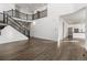Open foyer showcasing staircase, hardwood floors, and access to the kitchen area at 9359 Russell Cir, Arvada, CO 80007